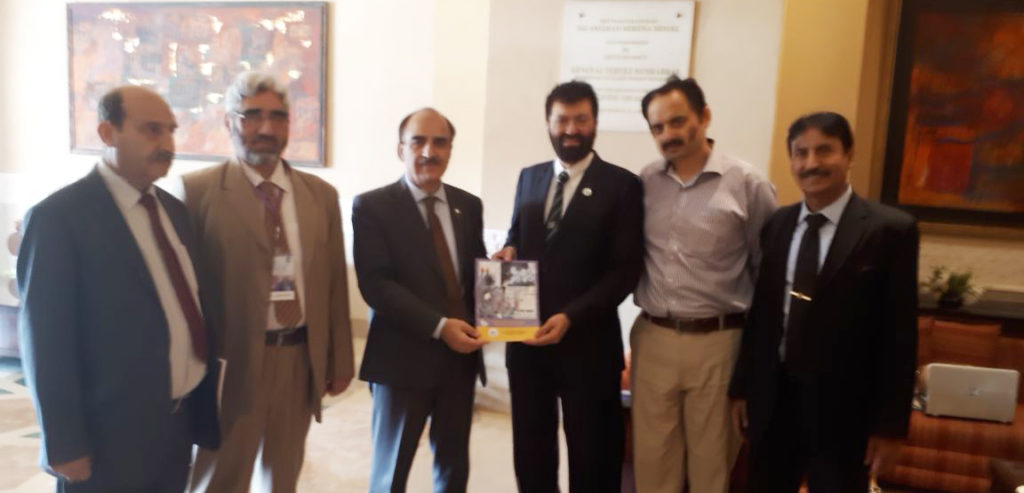 Dr. Attaullah Shah presented his book to Chairperson HEC